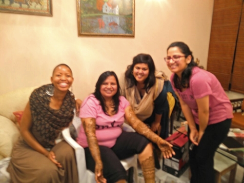  T he bride to be is the one with the mendhi on her hands and feet