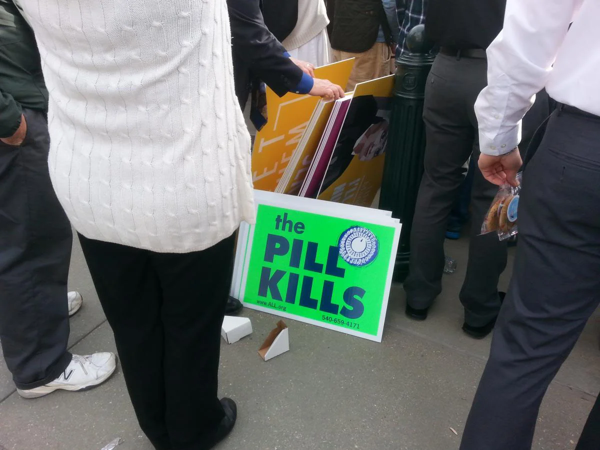 Anti-birth control activists protest outside the U.S. Supreme Court