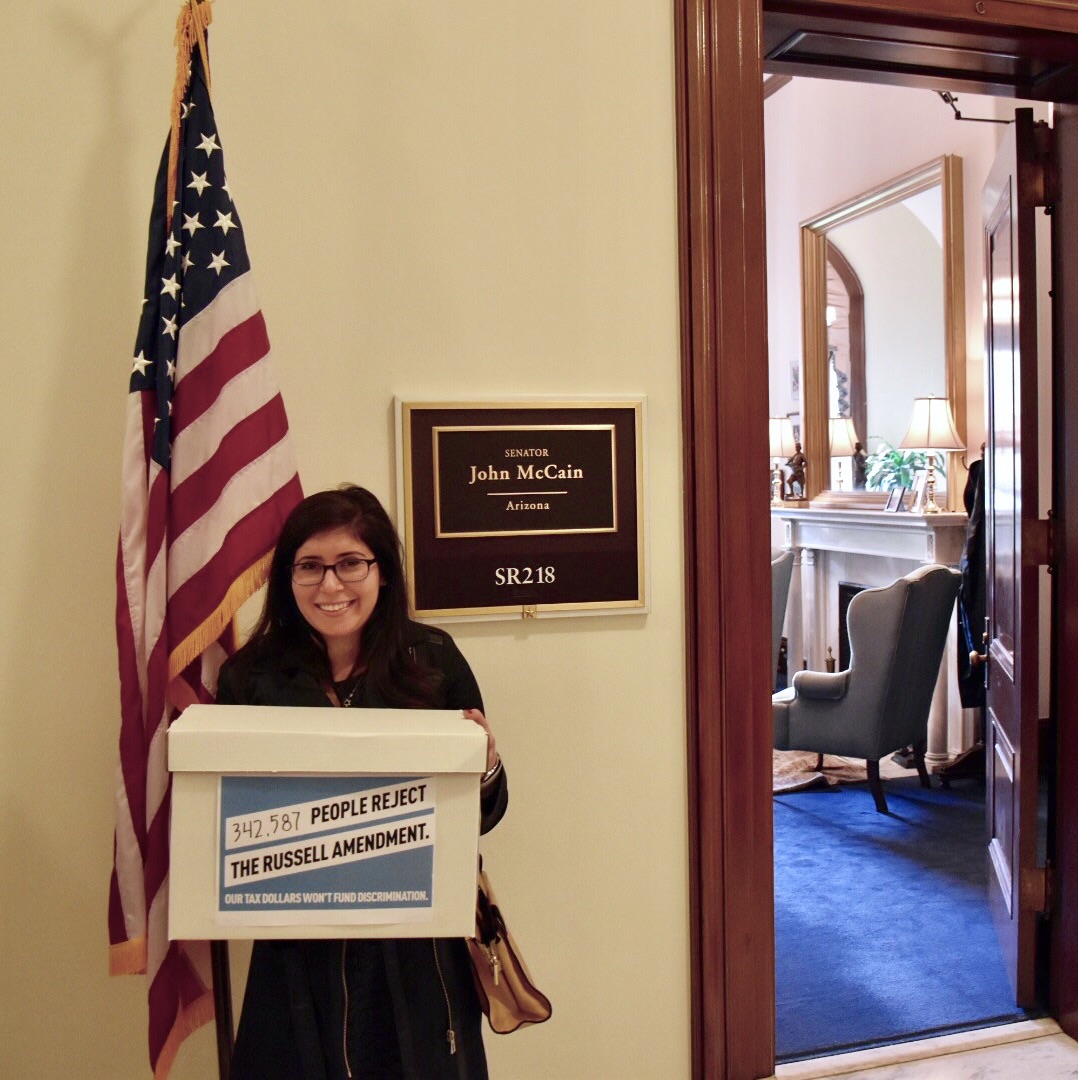 Americans United's Legislative Assistant Samanatha Sokol delivering petitions.