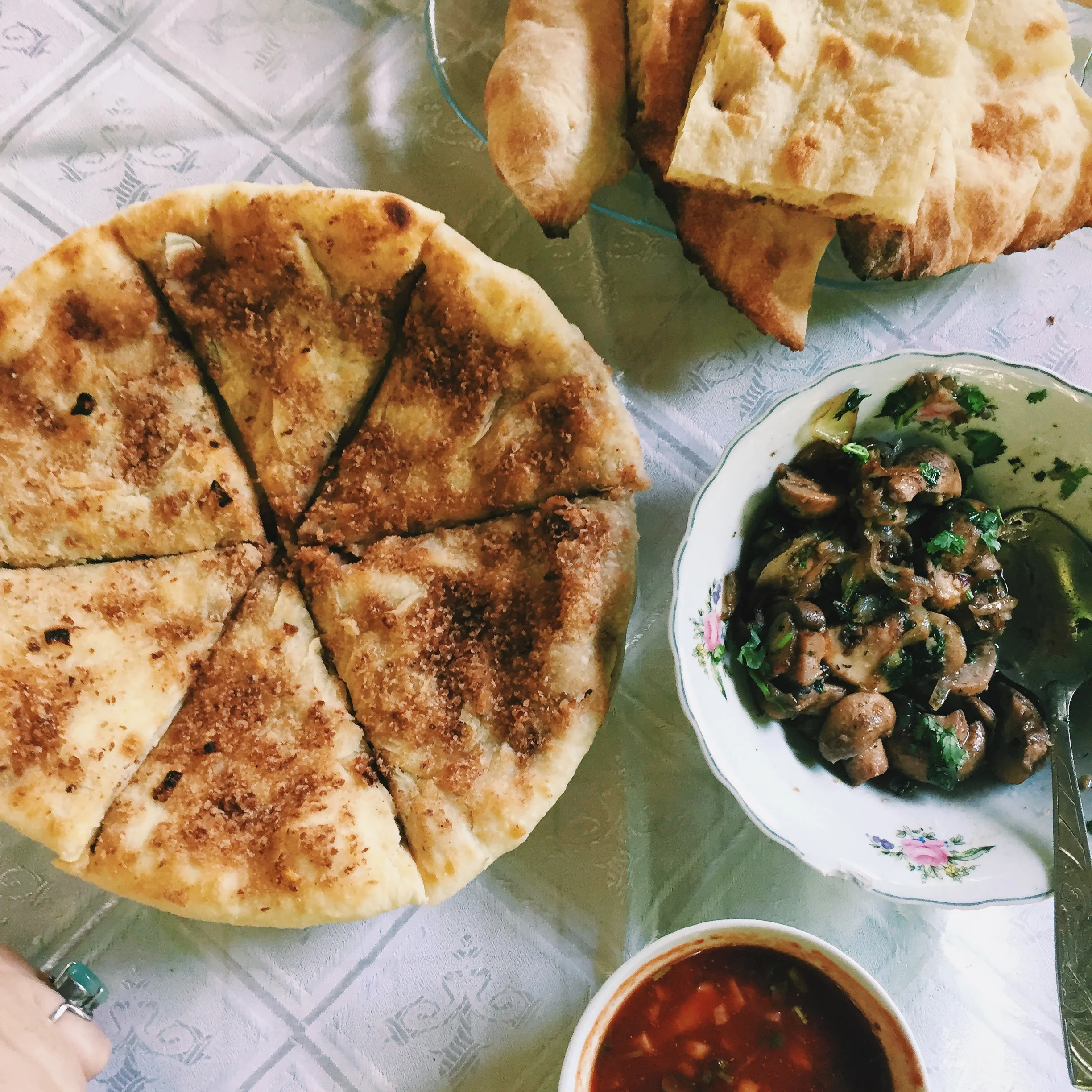 Lobiani khatchapuri (bean filled bread), soko (sautéed mushrooms with onions and herbs), and satsabeli (spicy fresh tomato sauce). 