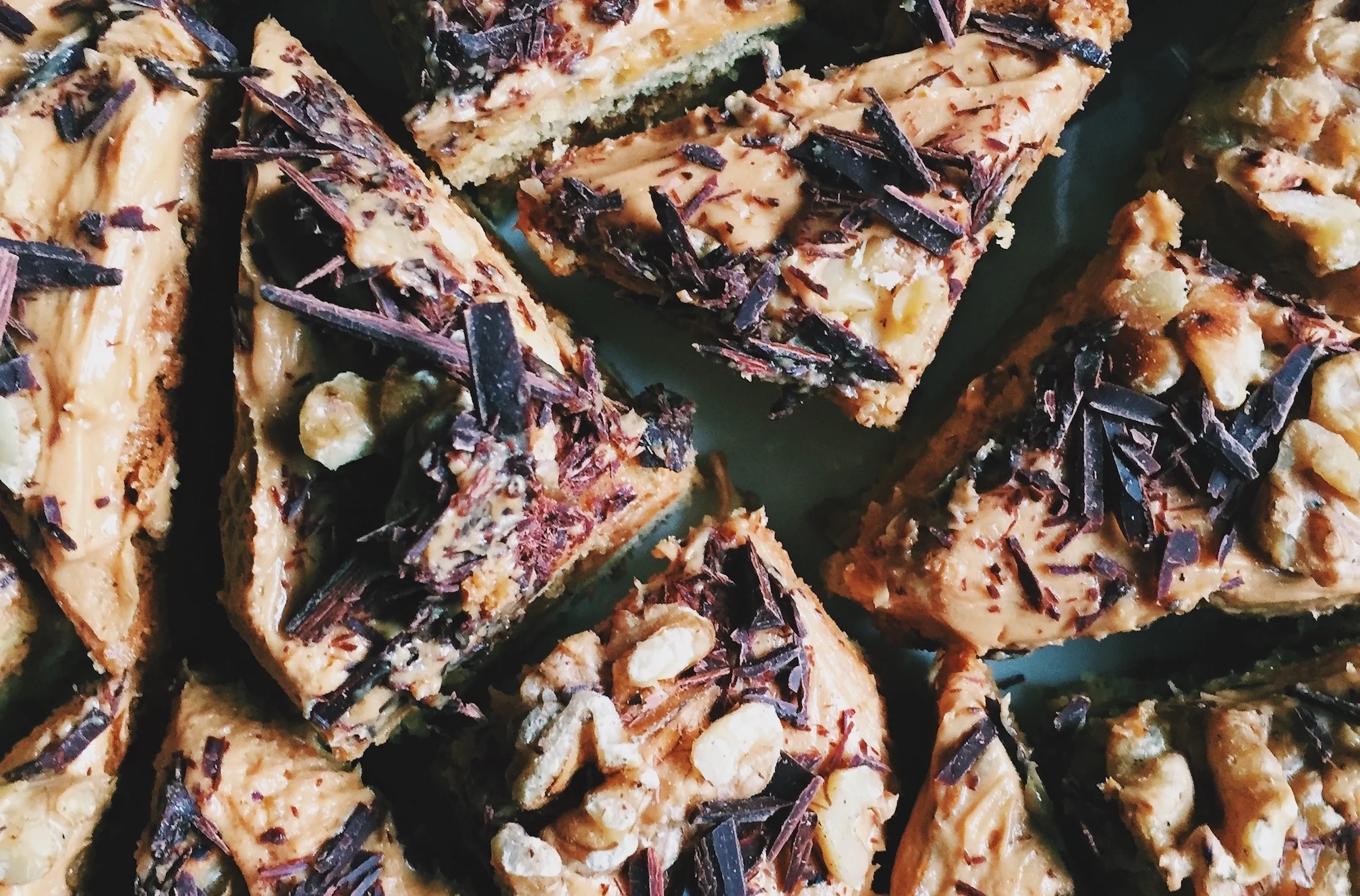 Russian Ideal (pronounced ee-dee-al). A dense layered honey cake with a dulce de leche filling, topped with shaved chocolate and walnuts. 