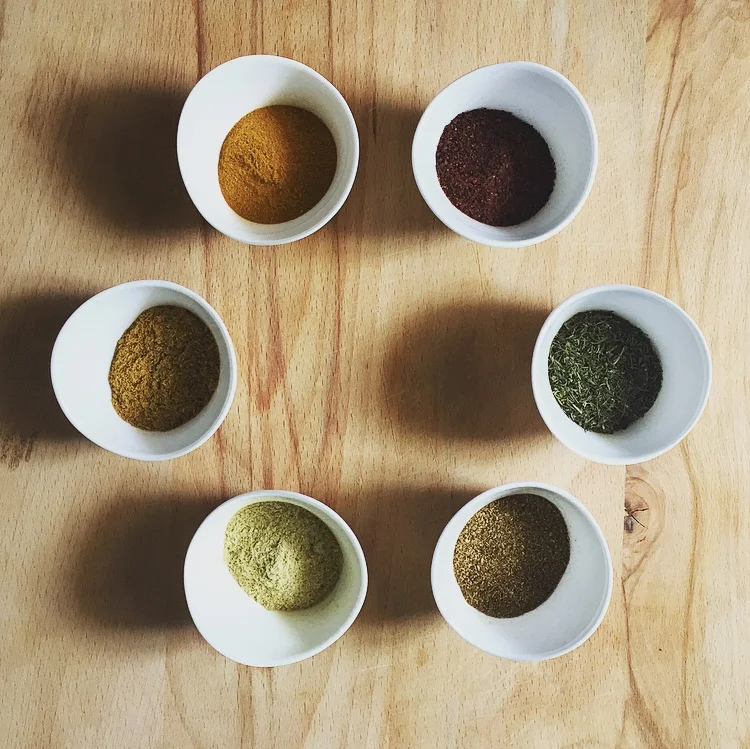 From top left to right: Zaprana (dried marigold), arbaris (barberry), kondari (summer savory), kindzi (coriander), u tk skho-suneli (blue fenugreek), and khmeli-suneli . 