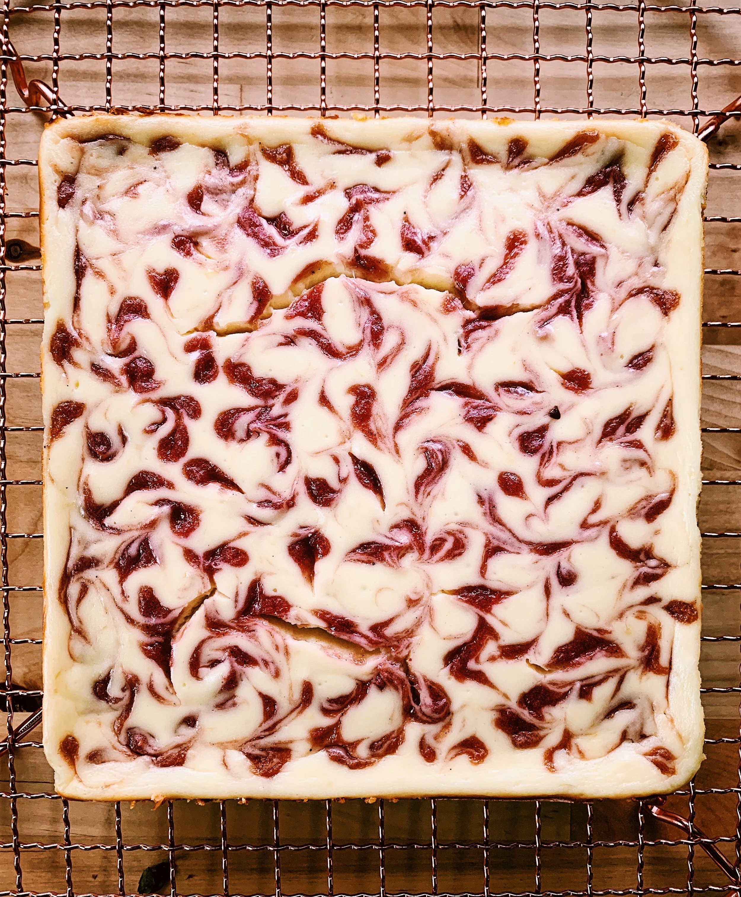 Labneh Cheesecake Bars with Rhubarb Cardamom Swirl