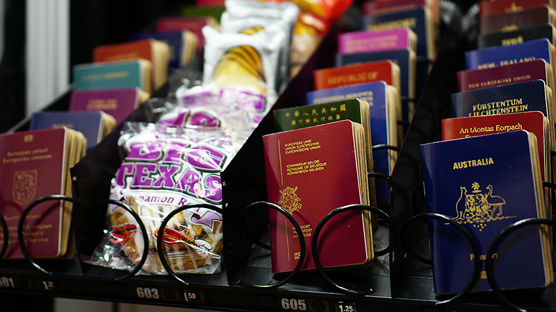   World’s Passports , 2016, Silkscreen on paper, vending machine, each 4 x 5 in  