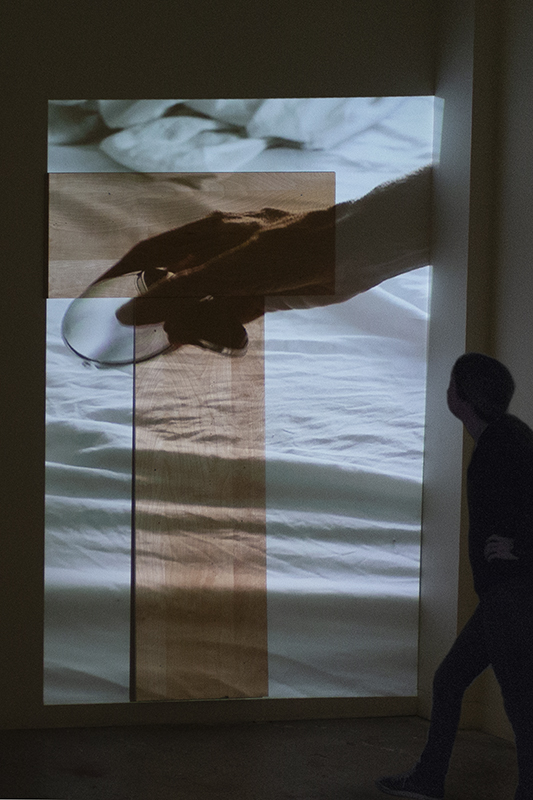 Allison Hunter, installation view, “Compact,” 2017, single-channel video installation with wood form, SVA Open Studios, New York, NY.