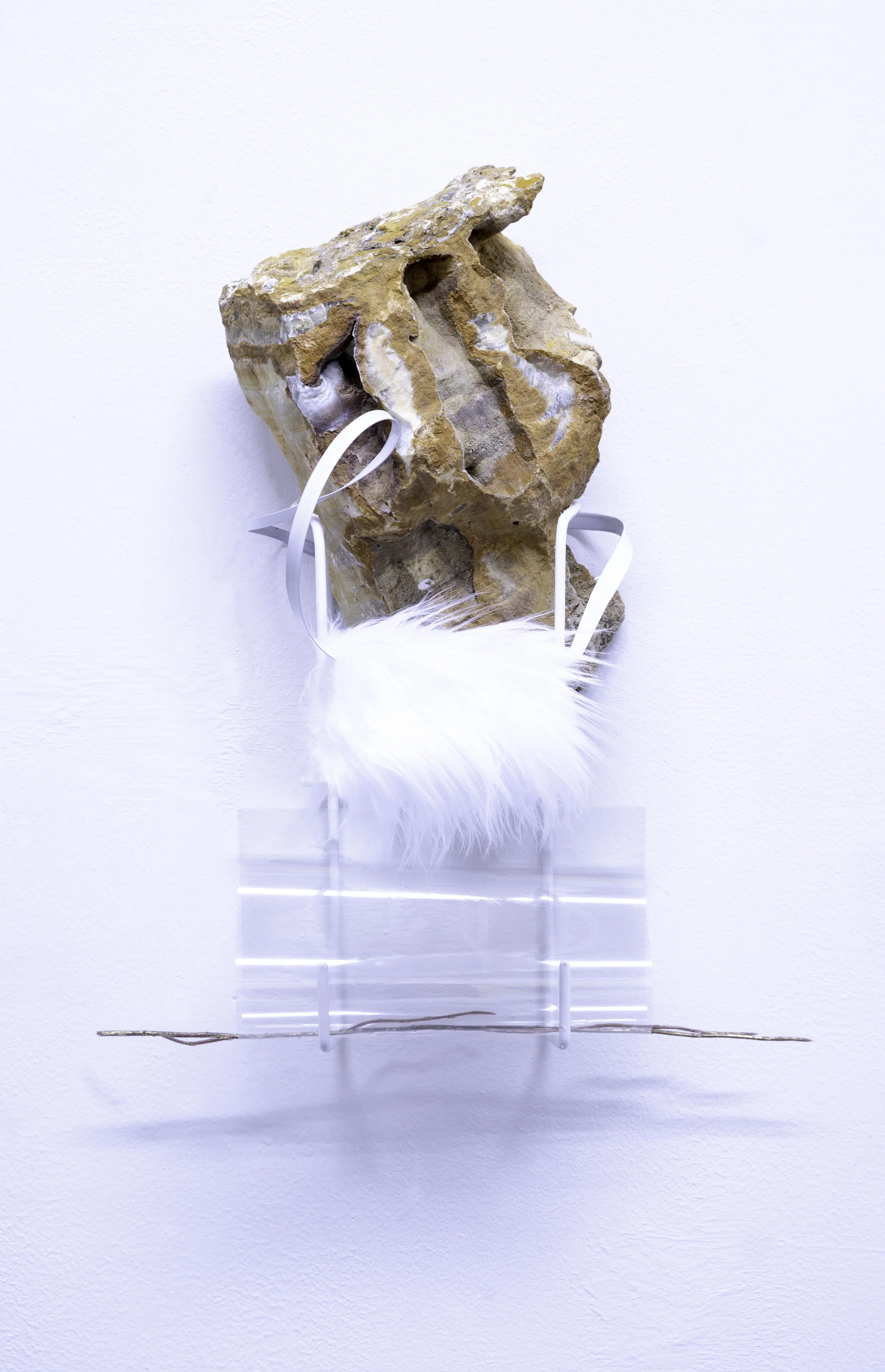 Heavy Coziness, 2019, stone, iron hook, branch, transparency film, 18 x 15