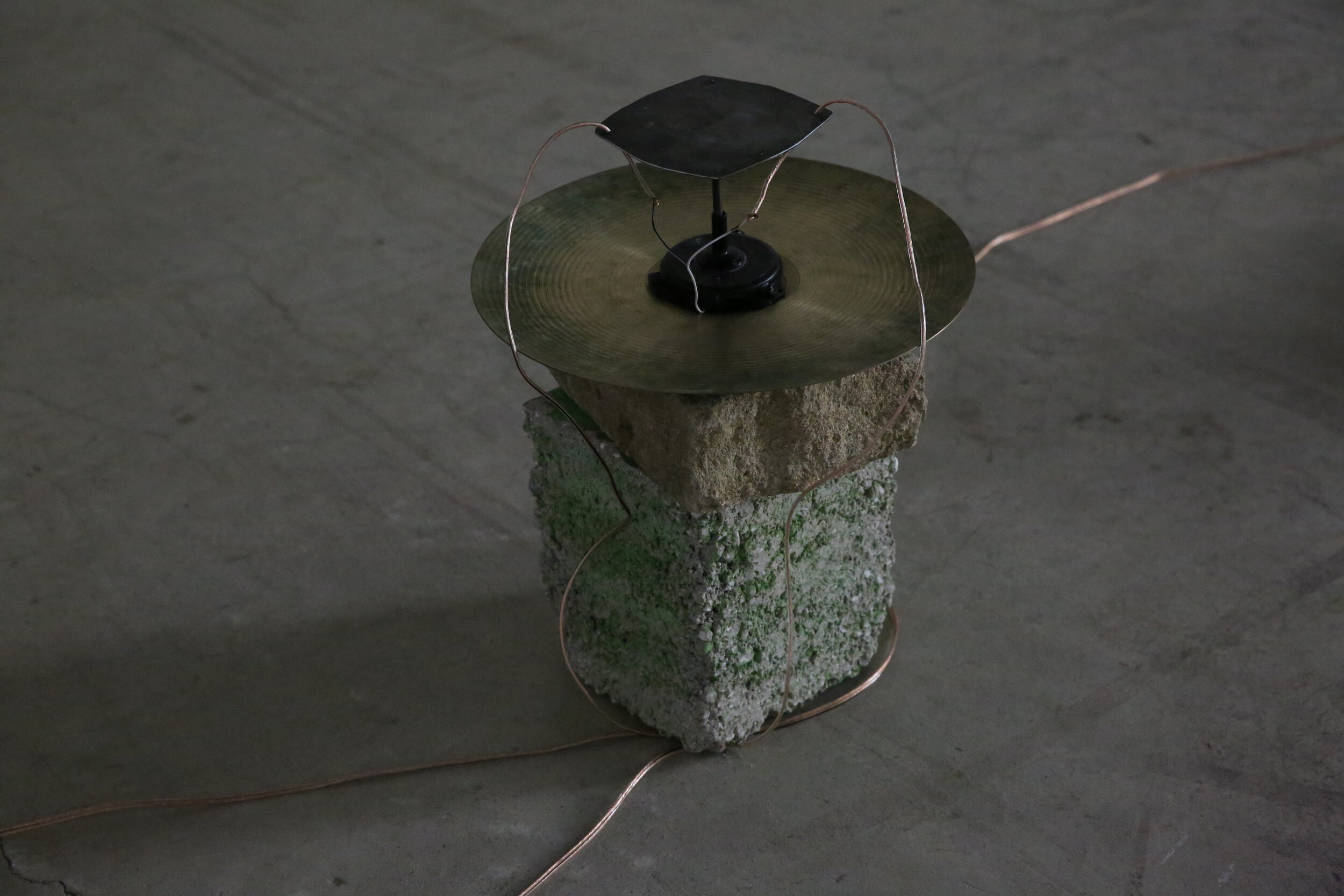Untitled (Sinmungo), 2019 (Installation Detail) cymbals, gong, stone, wire, electronics, tactile transducer dimensions variable