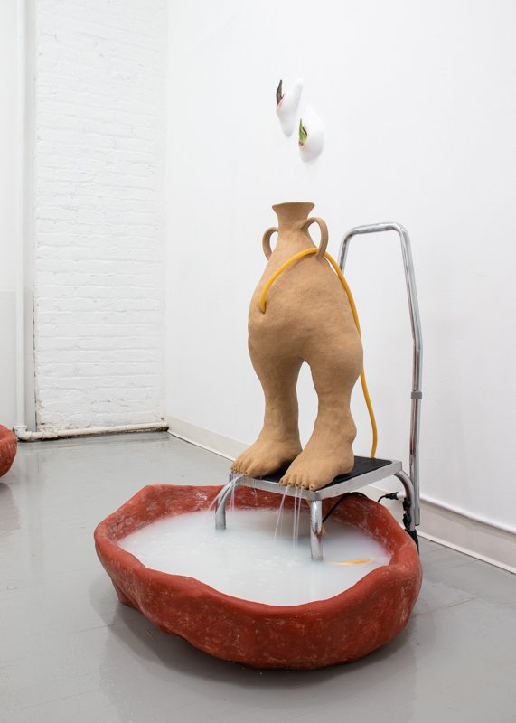  Look at her tears, they have been poured into a leg, 2021, 35” x 25” x 28”, Ceramic stoneware, medical step stool, fiberglass reinforced gypsum cement, wax, latex tubing, fountain pump, water, oil of milk 