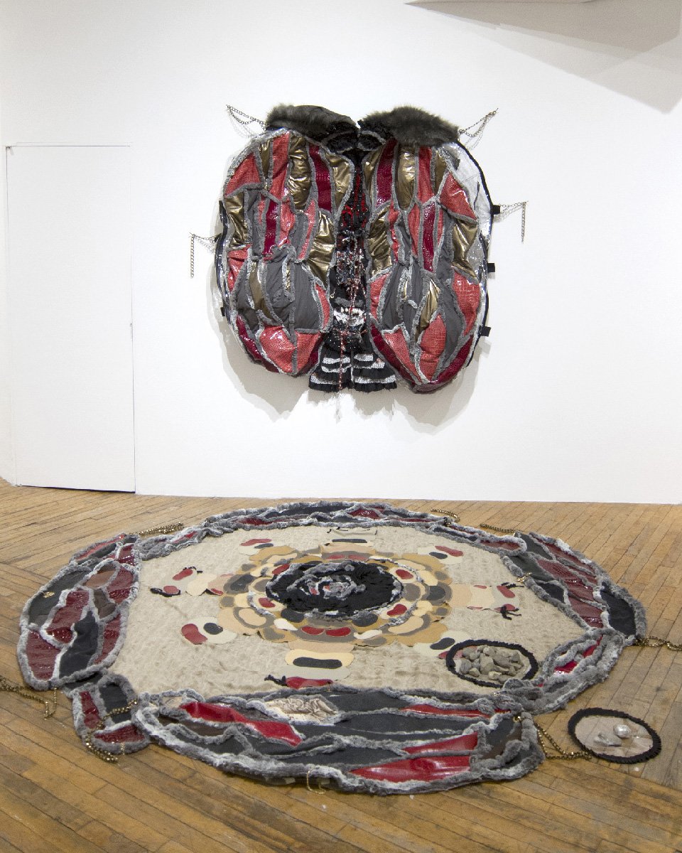   Shed-Wings Storage , 2018, Mixed media installation (Faux-fur, fabric, leather, vinyl, chain, stone), 70” x 54” x 7”/floor piece: 110” in diameter 