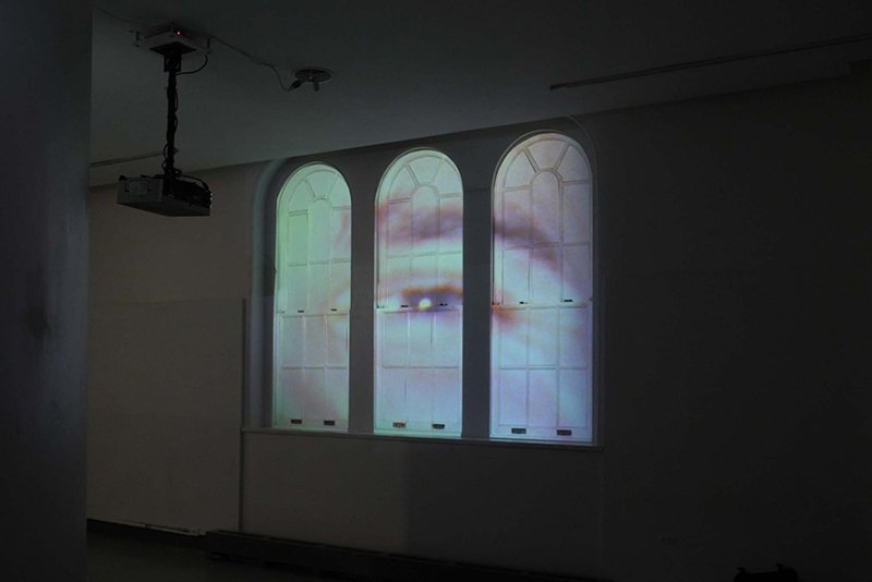   Photo Essay v.1 , 2019, HD video, color, sound, 09:07 min., two projectors, six 19th century Italianate windows, foam core  &nbsp; 