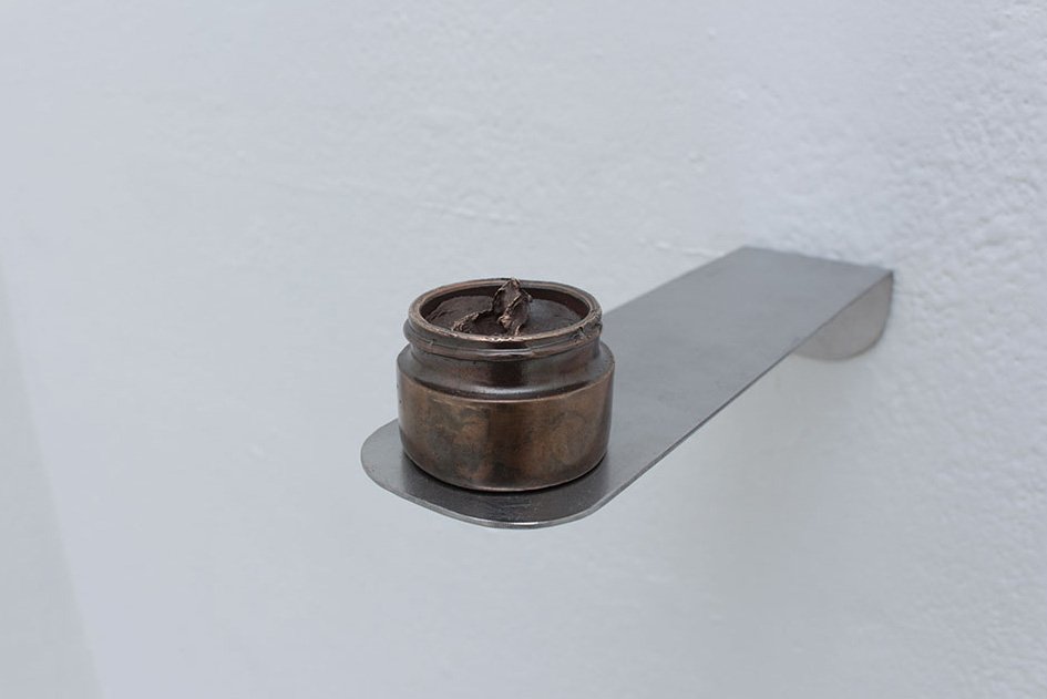   Dollop (lip balm),  2019, bronze, steel shelf, 6 x 5 x 21.5 in 