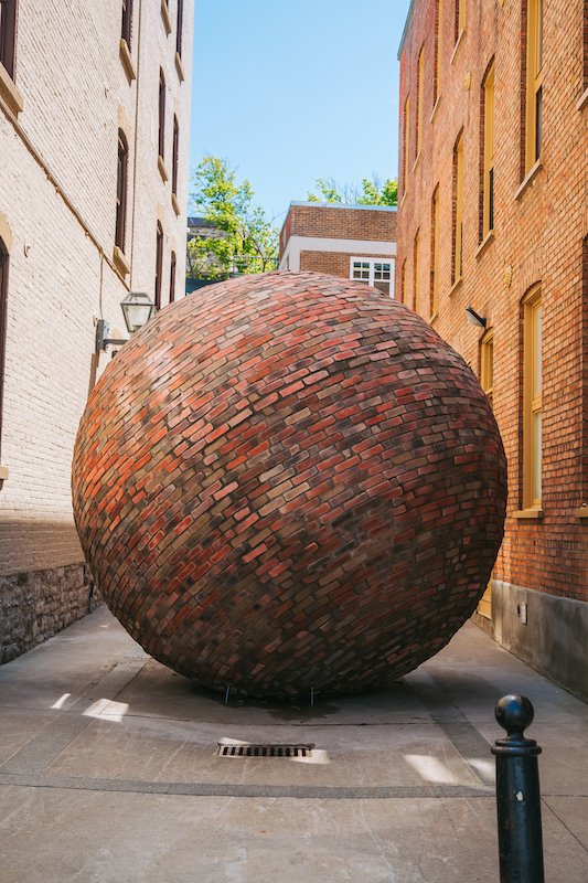   Echo , 2019, presented by Exmuro Public Arts, Quebec City, Canada  Bricks, mortar, fiberglass, wood, various hardware. 144 x 144 x 144 inches  Photo credit: Stéphane Bourgeois  