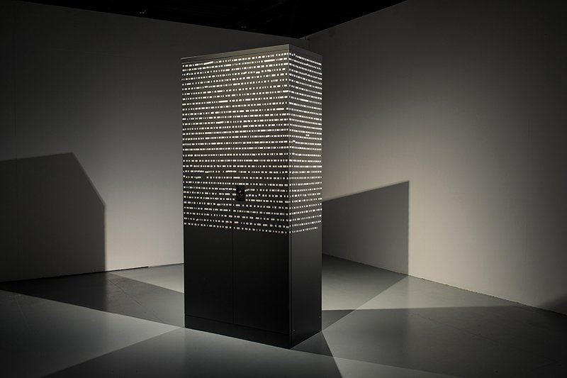   Verba Venenata , 2019, Steel cabinet, transcription of speech in magnetic lettering, 36 x 79 x 18” 