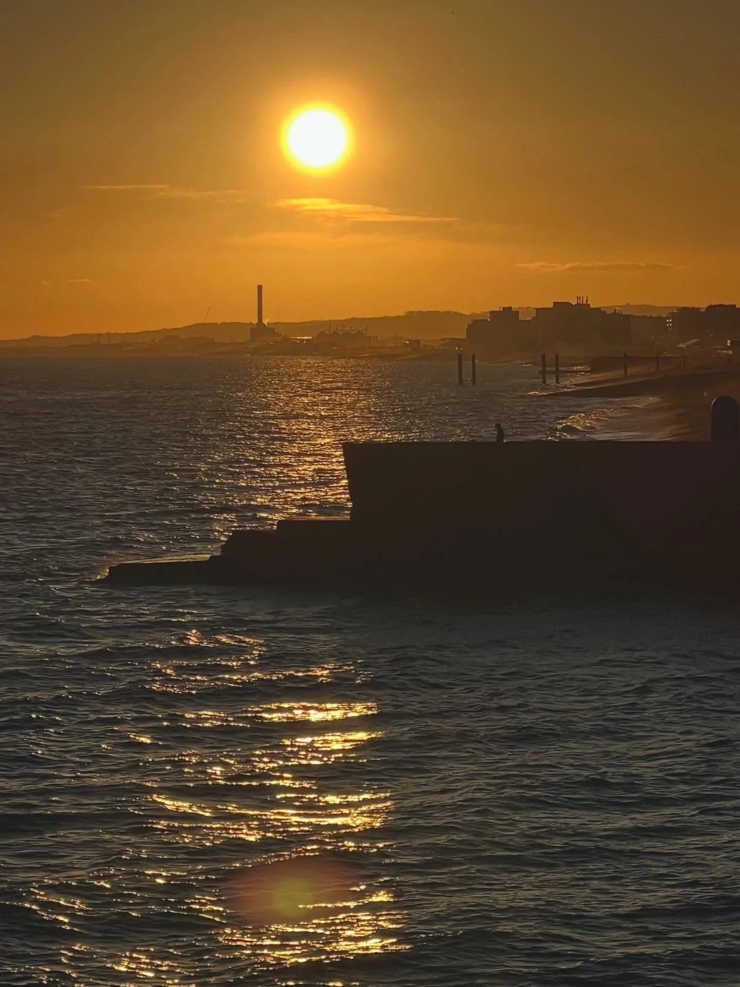 A peaceful, surreal sunset in Brighton Beach tonight. The sunshine had people in good moods, meeting up, smoking, laughing, walking the cold pebble beach. A gritty, salt swept, iconic spot, harboring all walks of life, letting them let loose. Nothing
