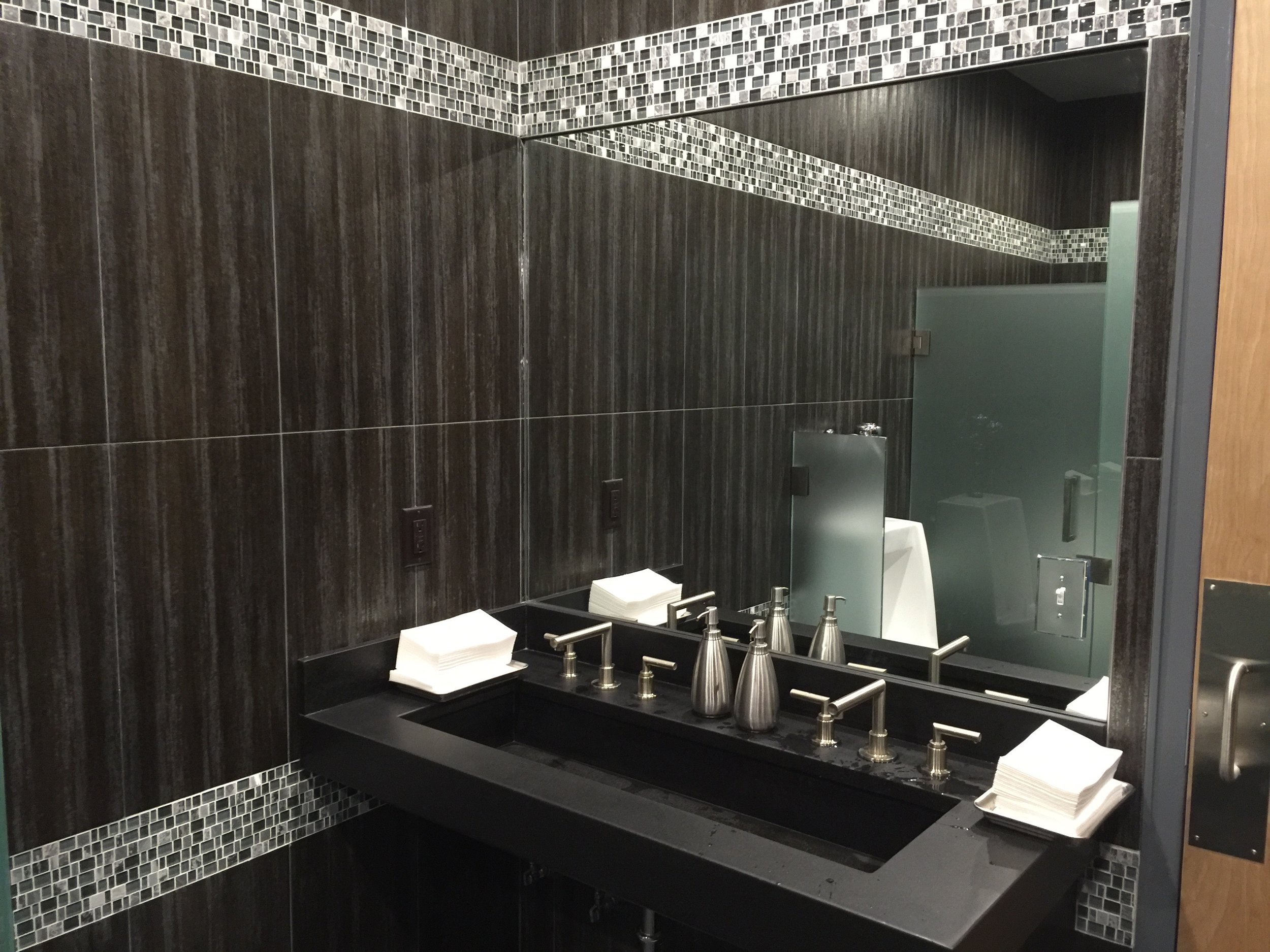 Men's Room with Custom Poured Concrete Trough Sinks