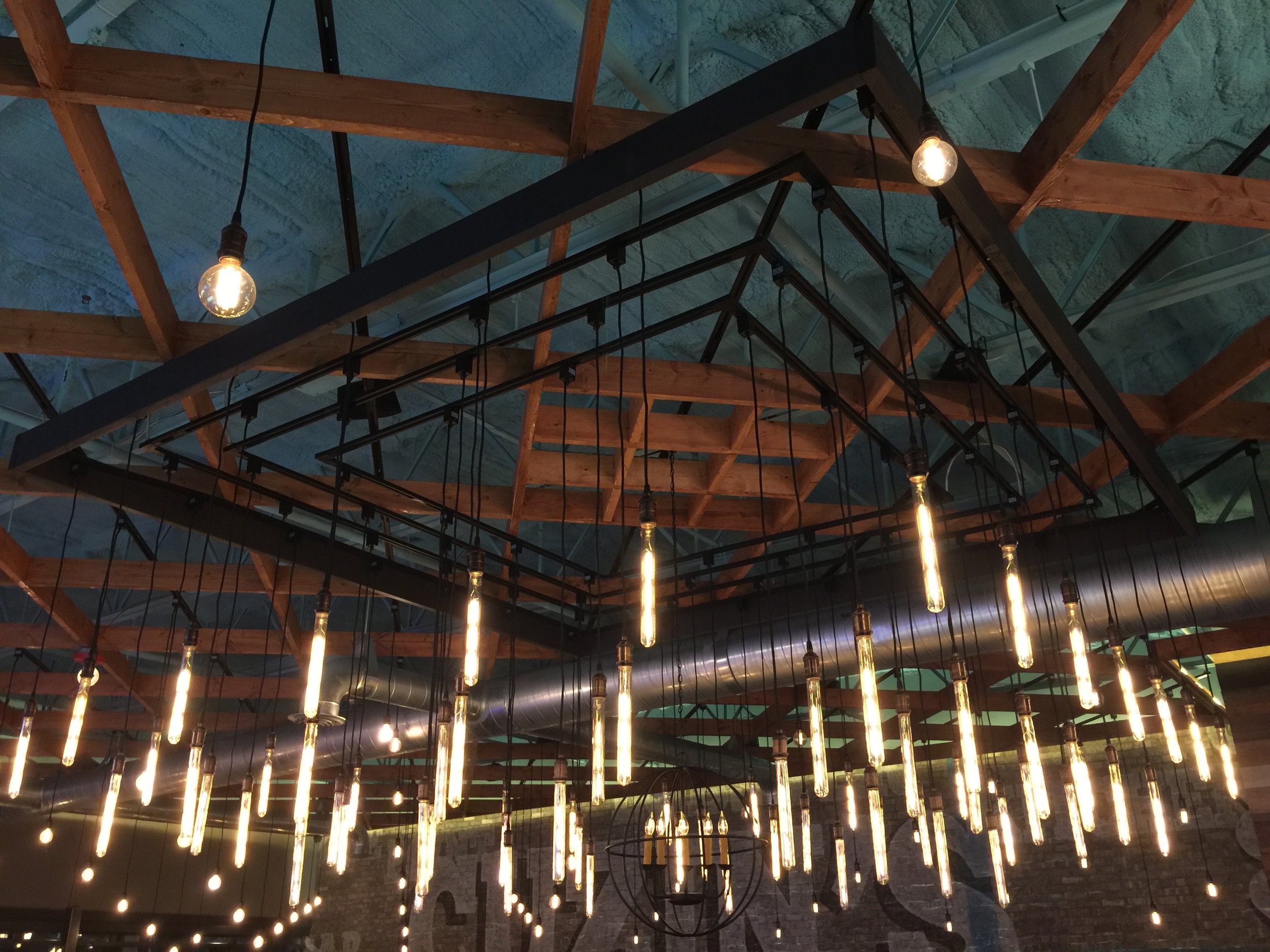 12' x 12' Custom Built Floating Filament Tube Bulb Chandelier over Pinwheel Banquette