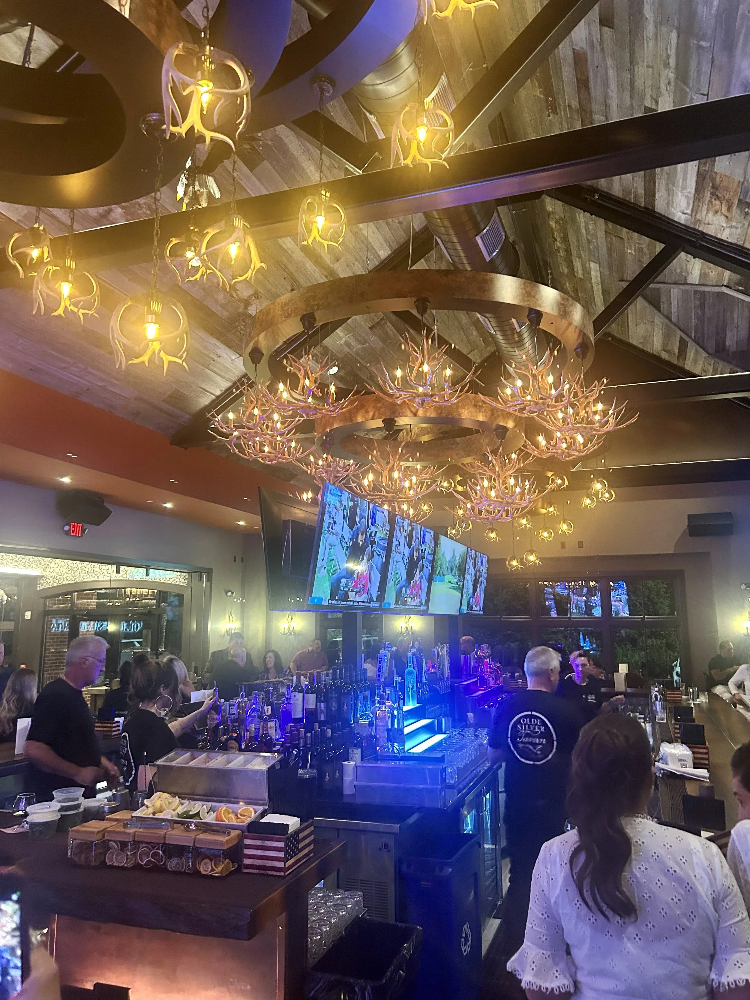 giant chandeliers designed by Raymond Haldeman the restaurant designer