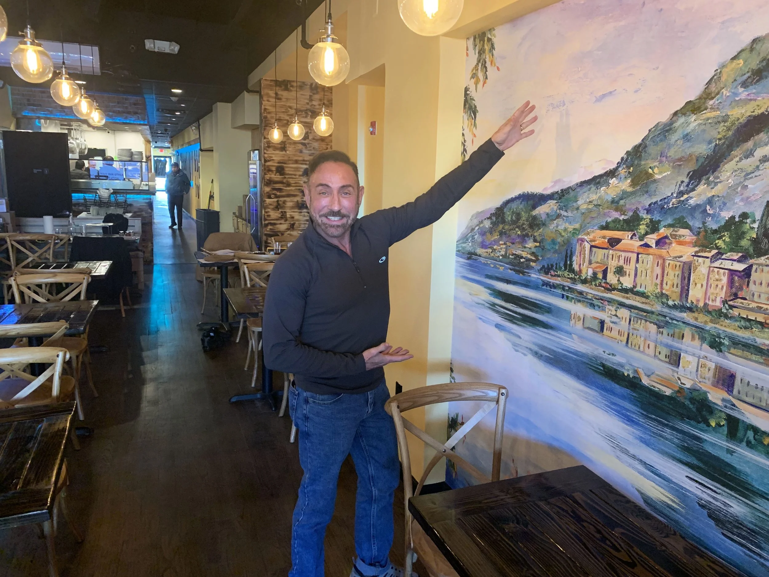 Raymond Haldeman shows off new mural at ViaSposito Restaurant