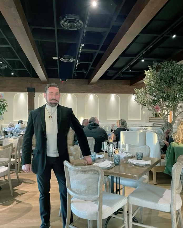 designer Raymond standing in Naxos restaurant