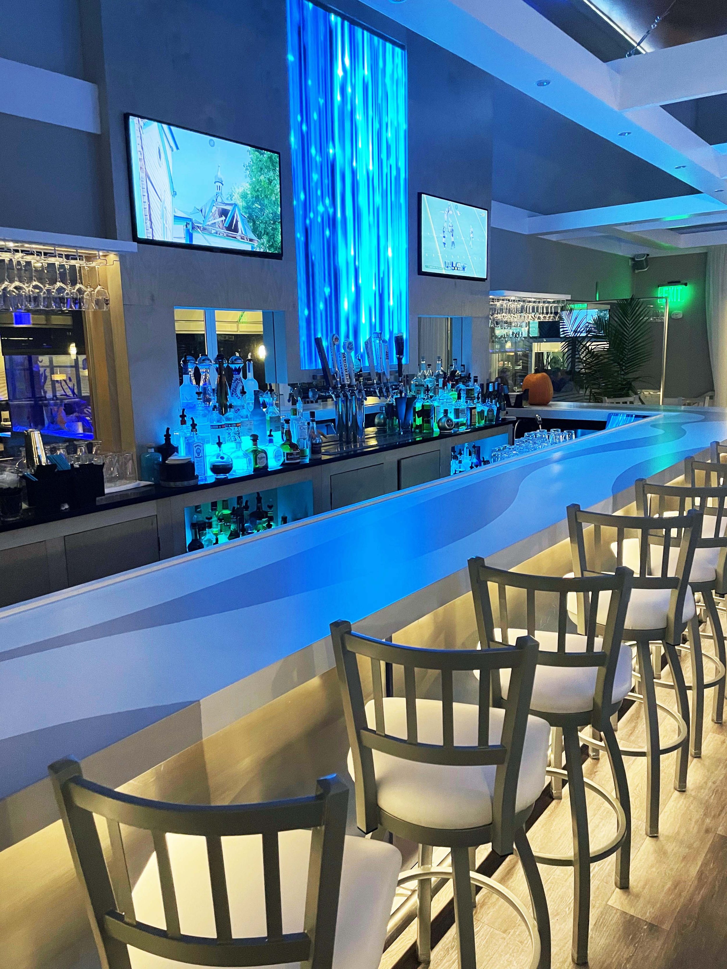 Led illuminated back bar and custom concrete bar top
