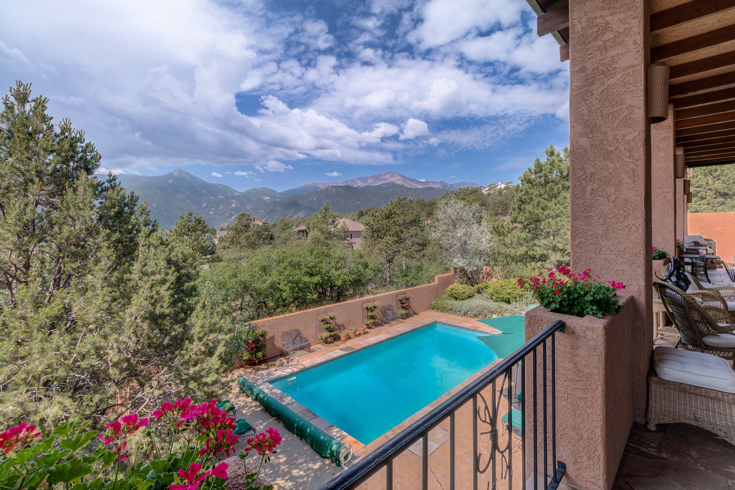 6-Back veranda overlooks 33x16 pool with more patio space.jpg