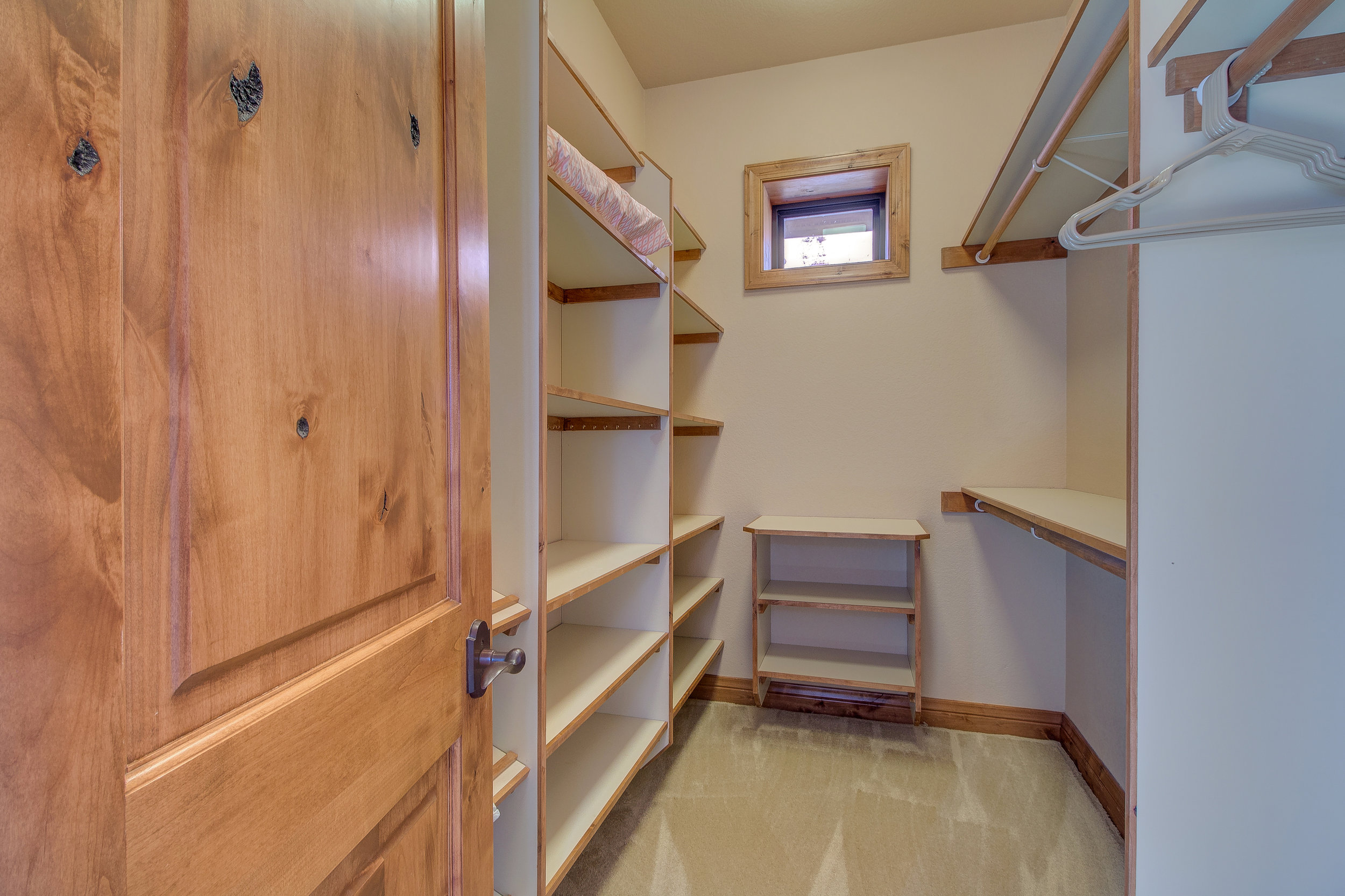 21-One of two walk in closets in the master suite.jpg
