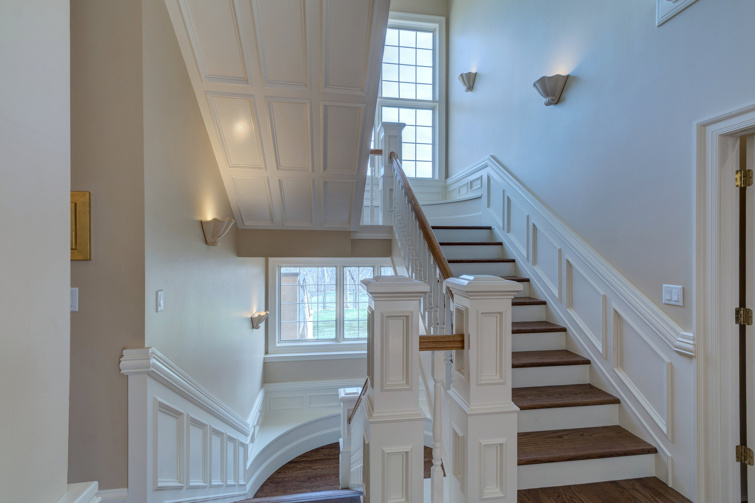 18-Gorgeous staircase to upper and lower levels.jpg