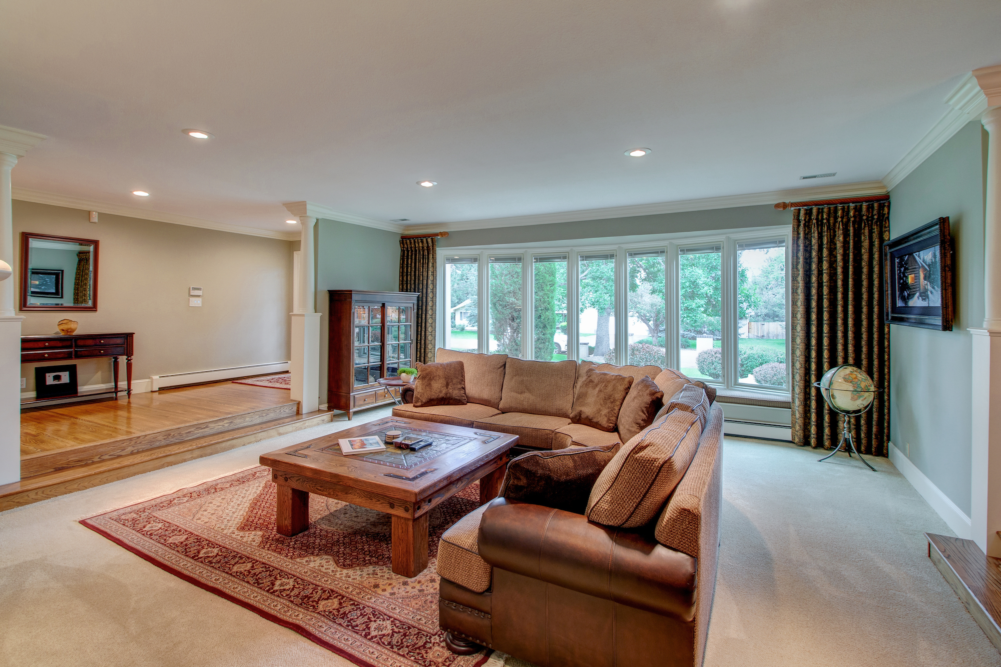 2-Living room has lovely bay window w seating bench.jpg