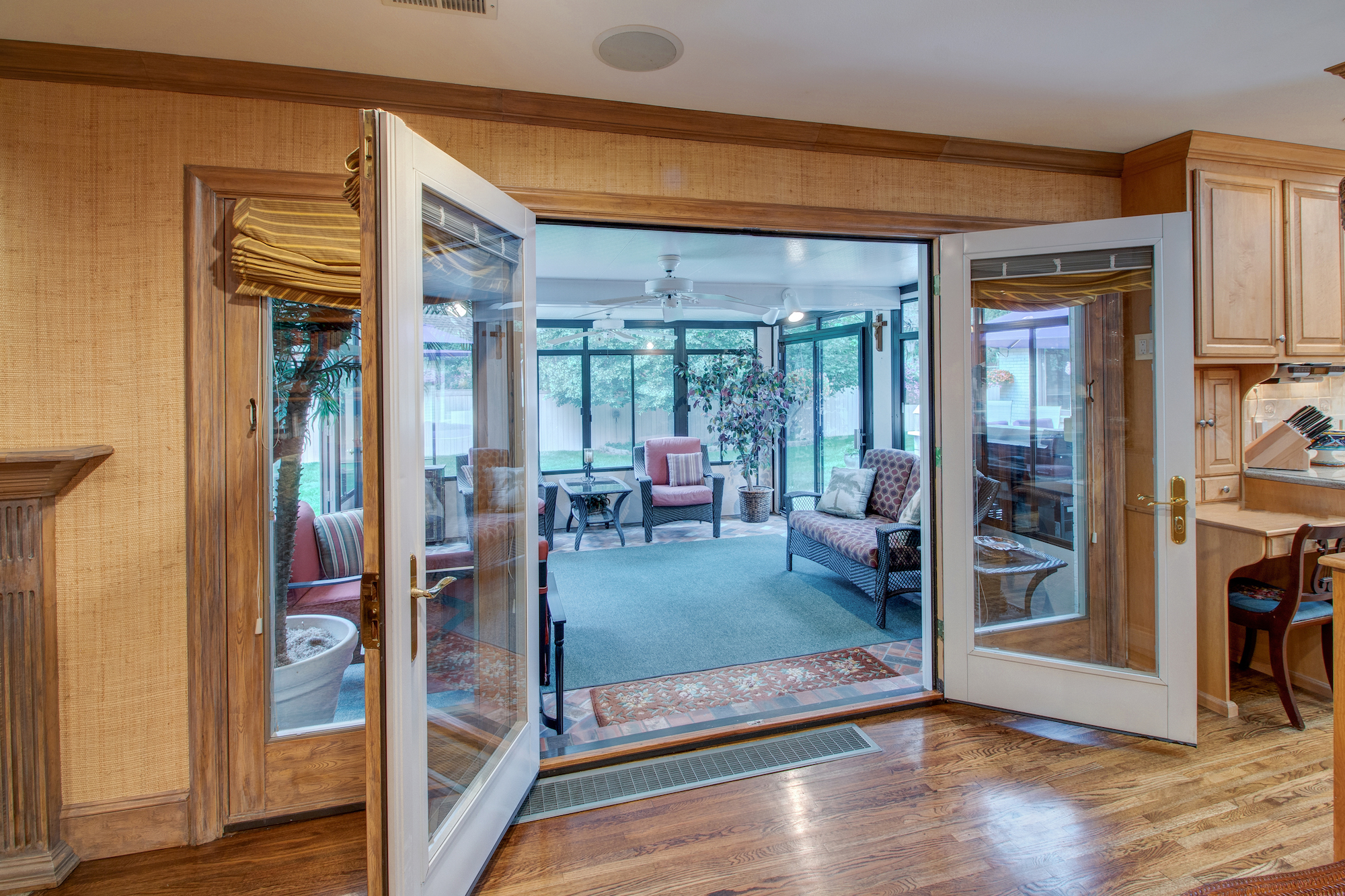 8-French doors in family room open to sunroom.jpg