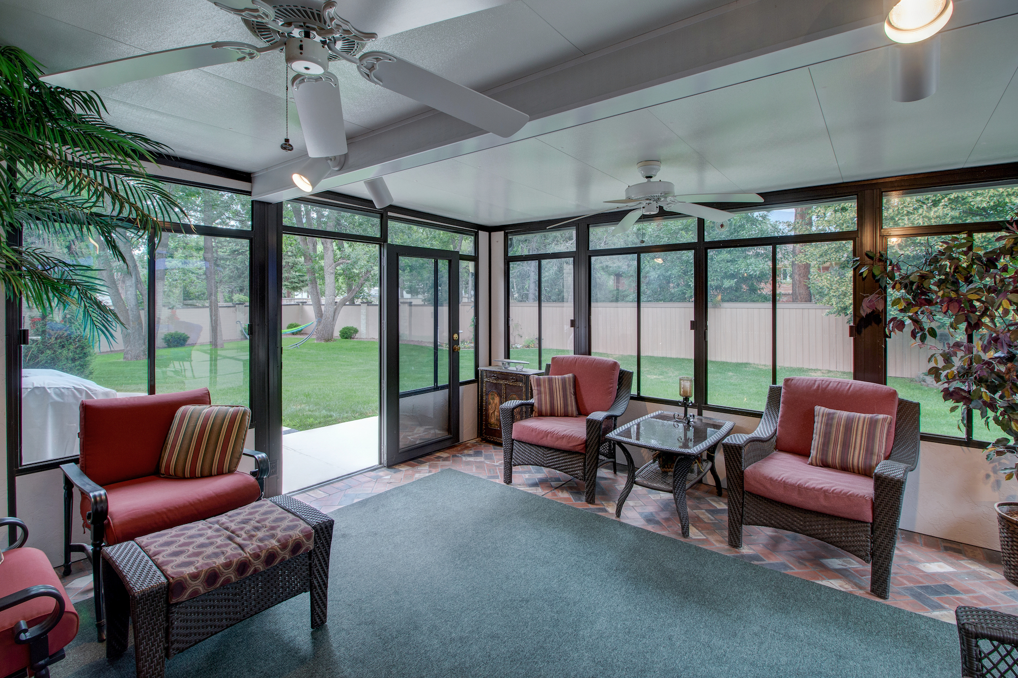 9-Sunroom opens to lush yard on the left.jpg