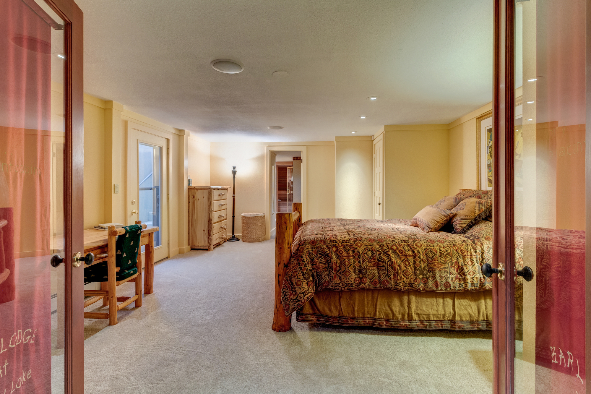22-Lower level guest suite w separate outside entrance and adjoining bathroom.jpg