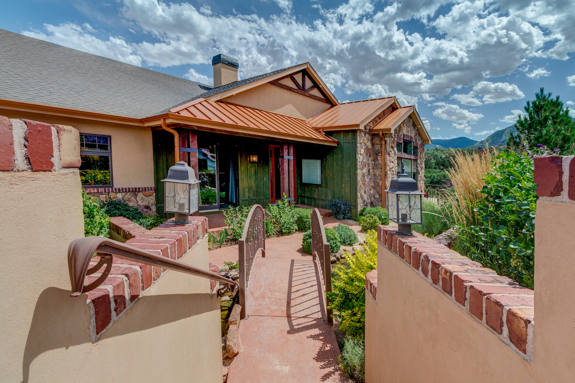 005-Fabulous home w courtyard entrance and a bridge going over an energetic stream.jpg