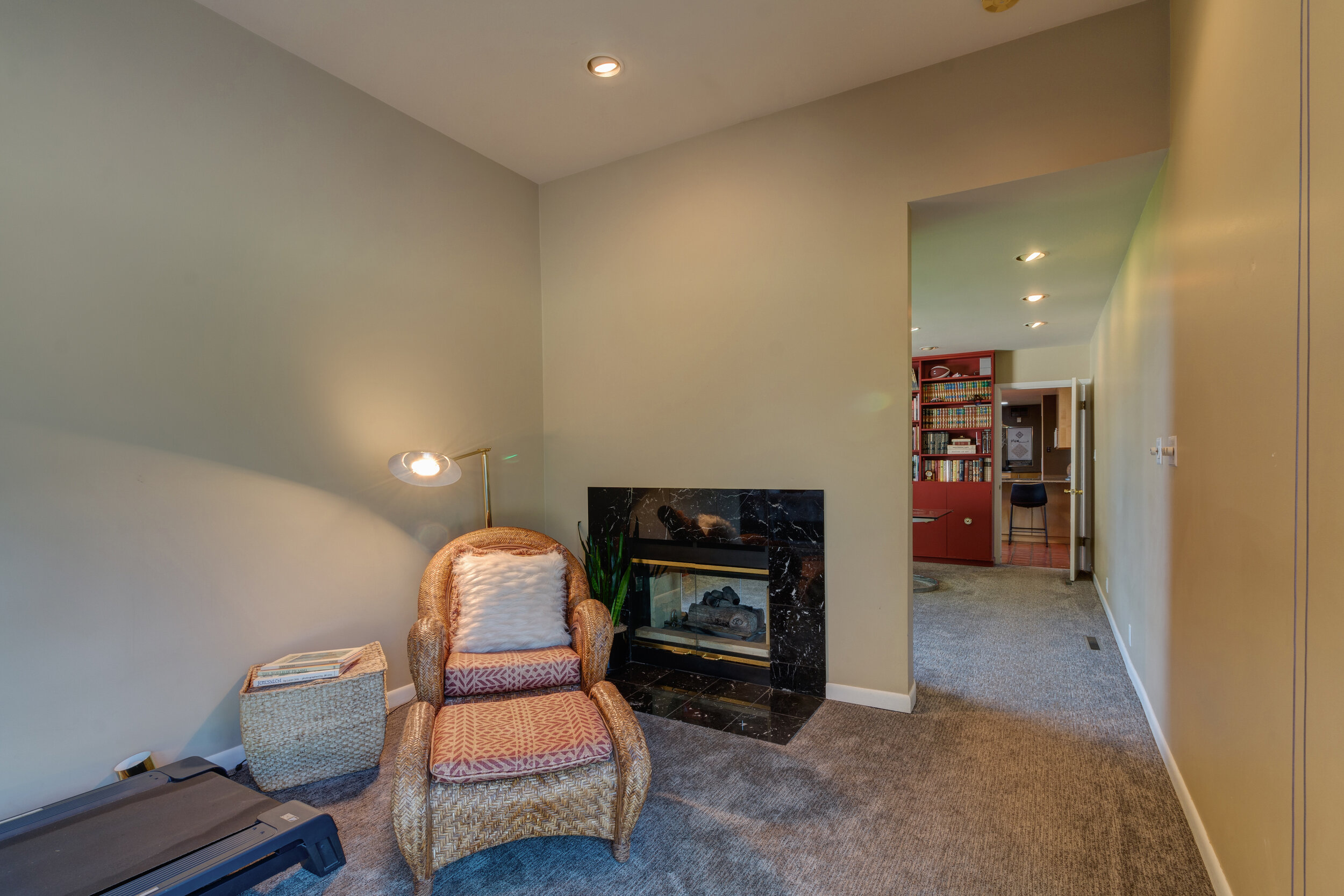 21-Master bedroom w master office on other side of fireplace.jpg