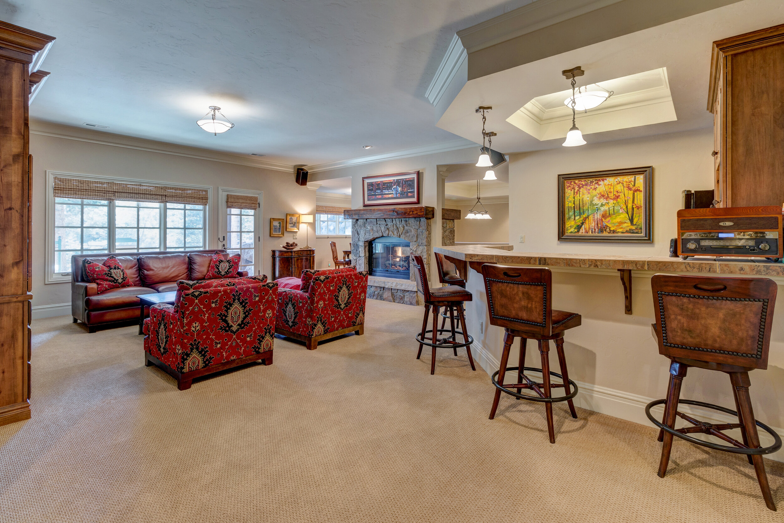 023.5-Family room in walk out lower lvl w wet bar fp + entertainment center-BroadlakeVw4935.jpg