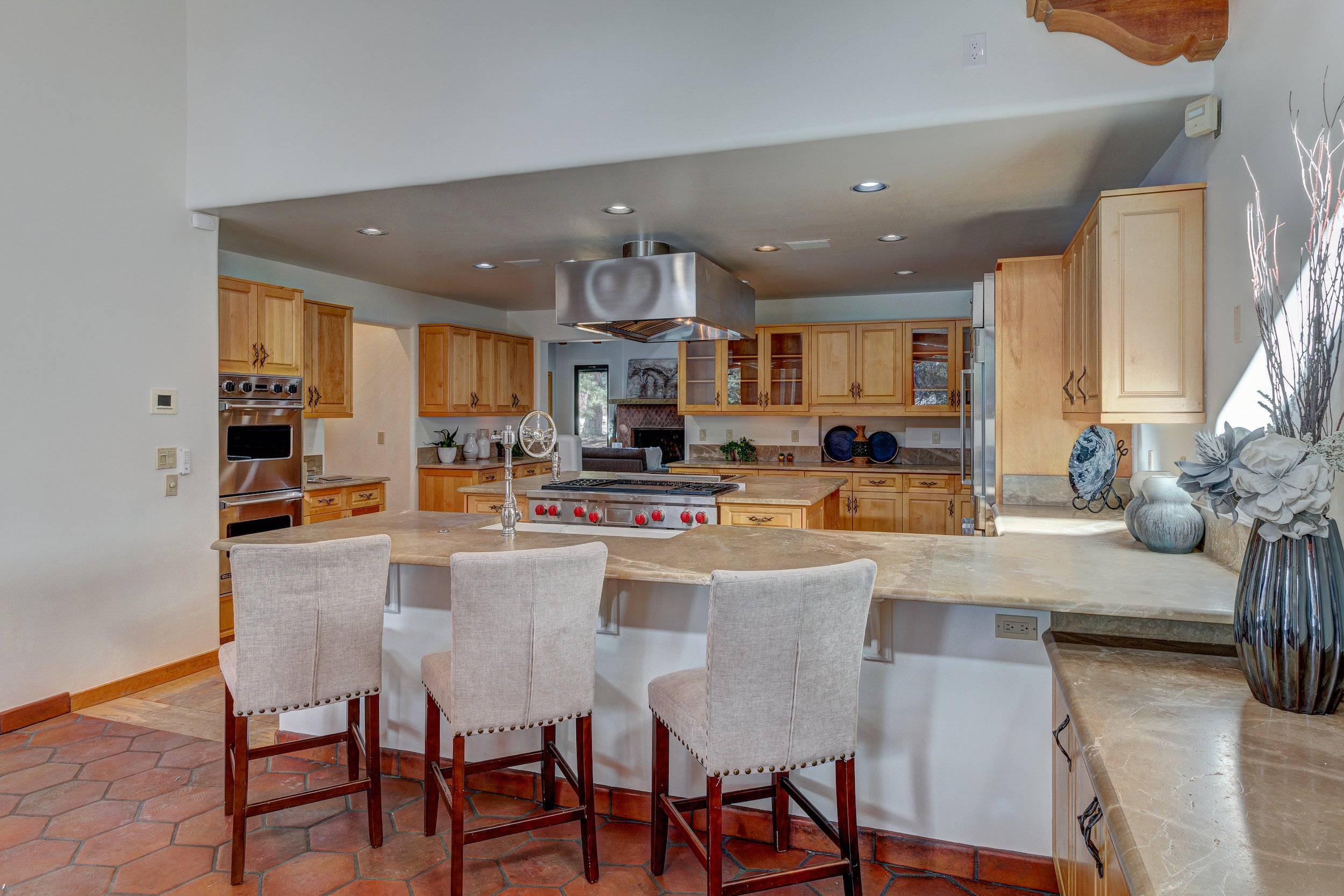 017-Kitchen w custom cabinets wolf gas cooktop + mexican soapstone countertop.jpg