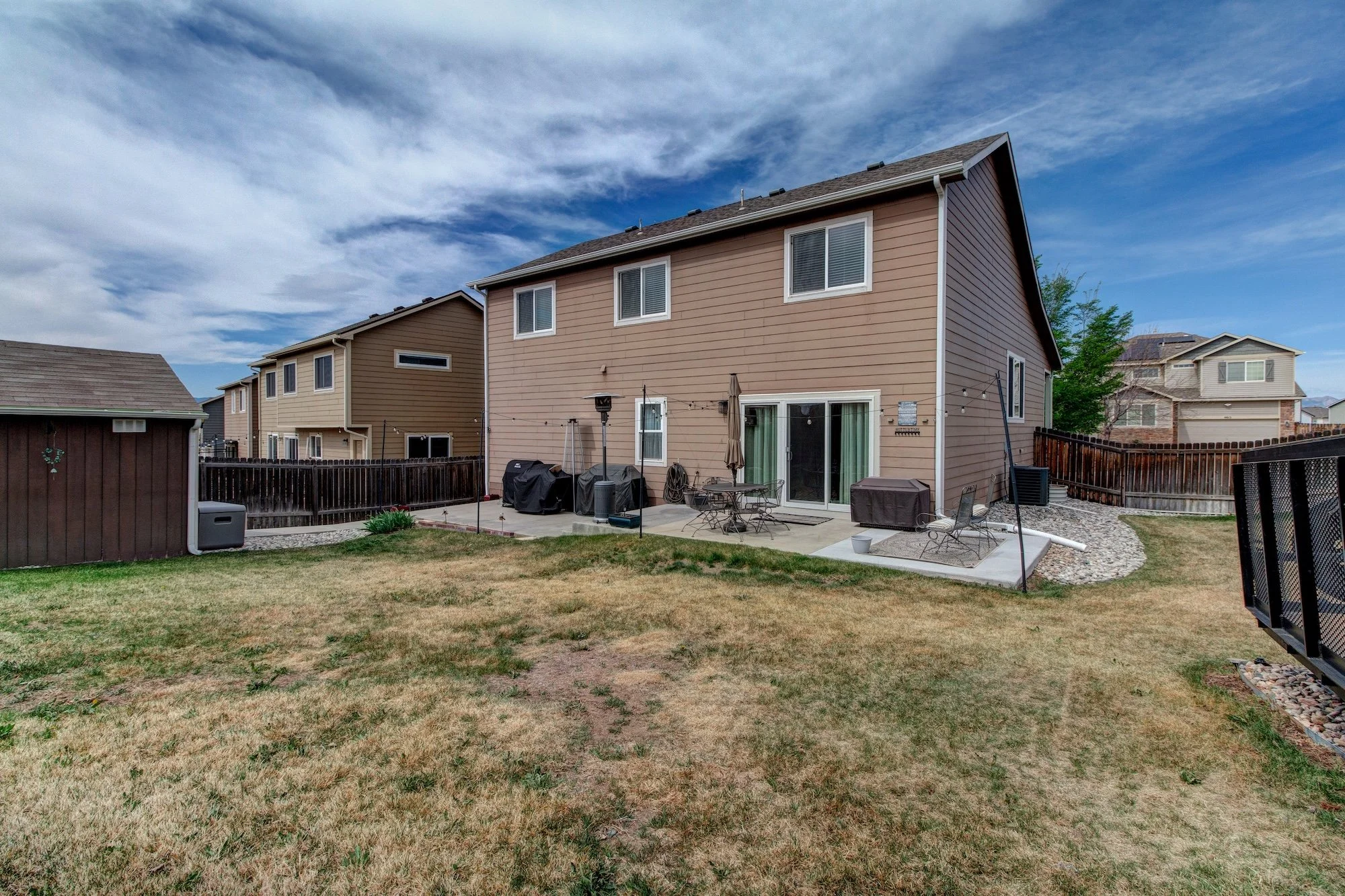 26-Back of home showing the 11x40 concrete patio.jpg