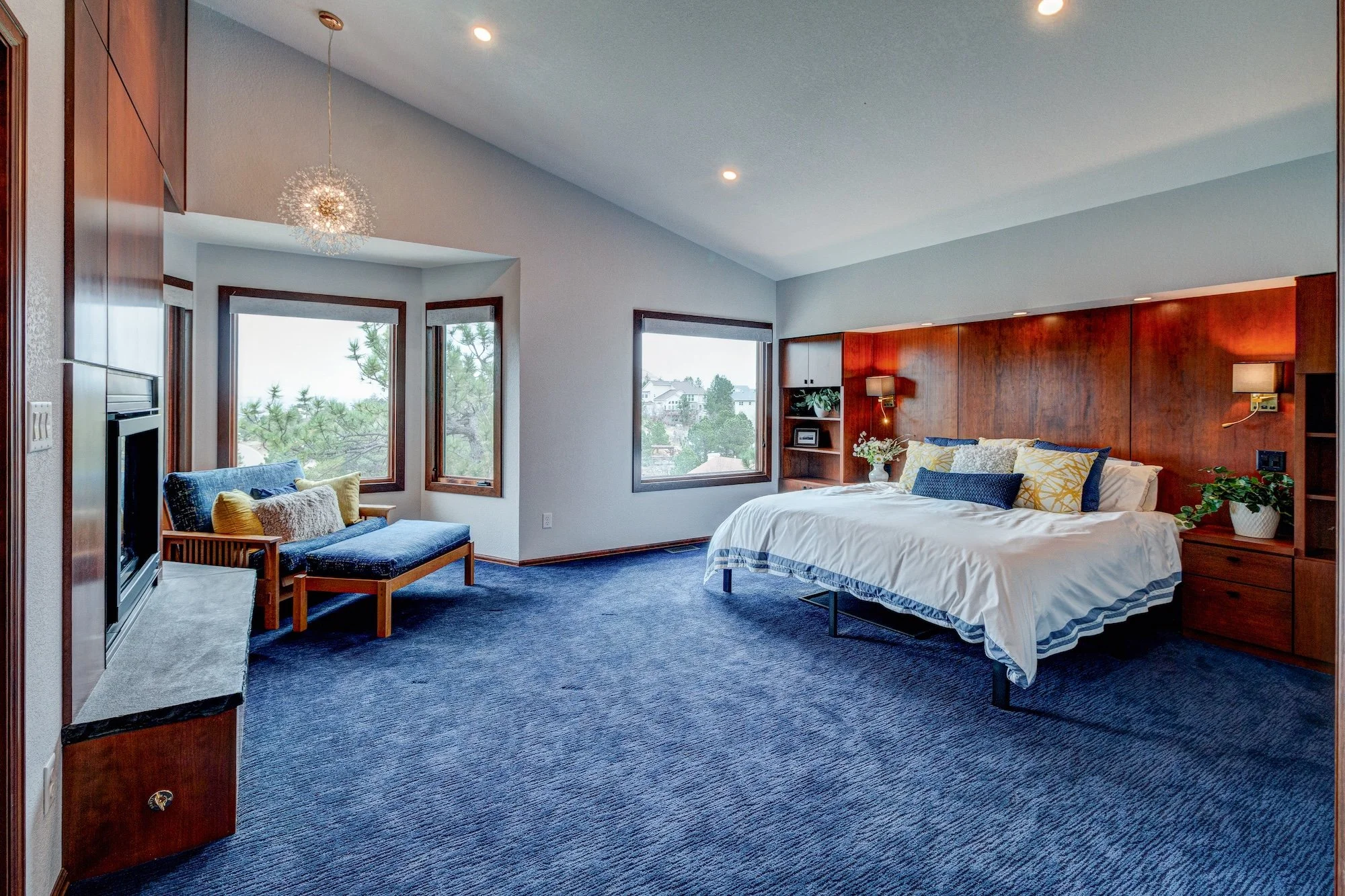 19.5-Primary BD w custom bed wall and matching fireplace wall.jpg