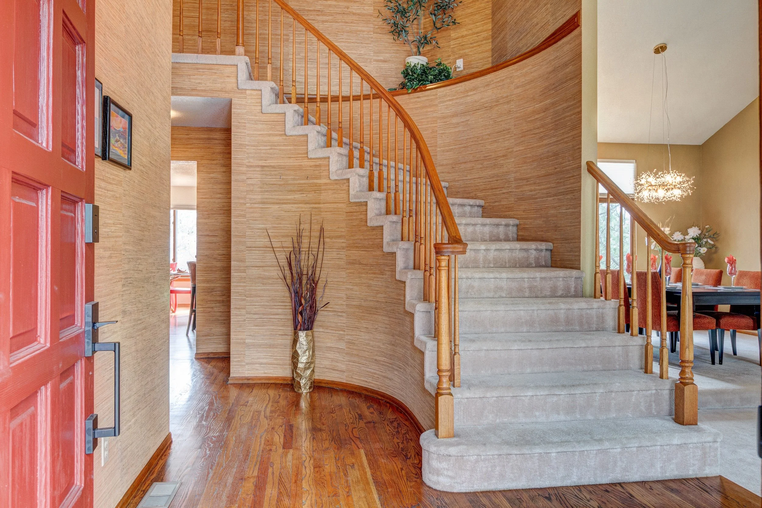3-Spacious entry hall with impressive circular staircase.jpg