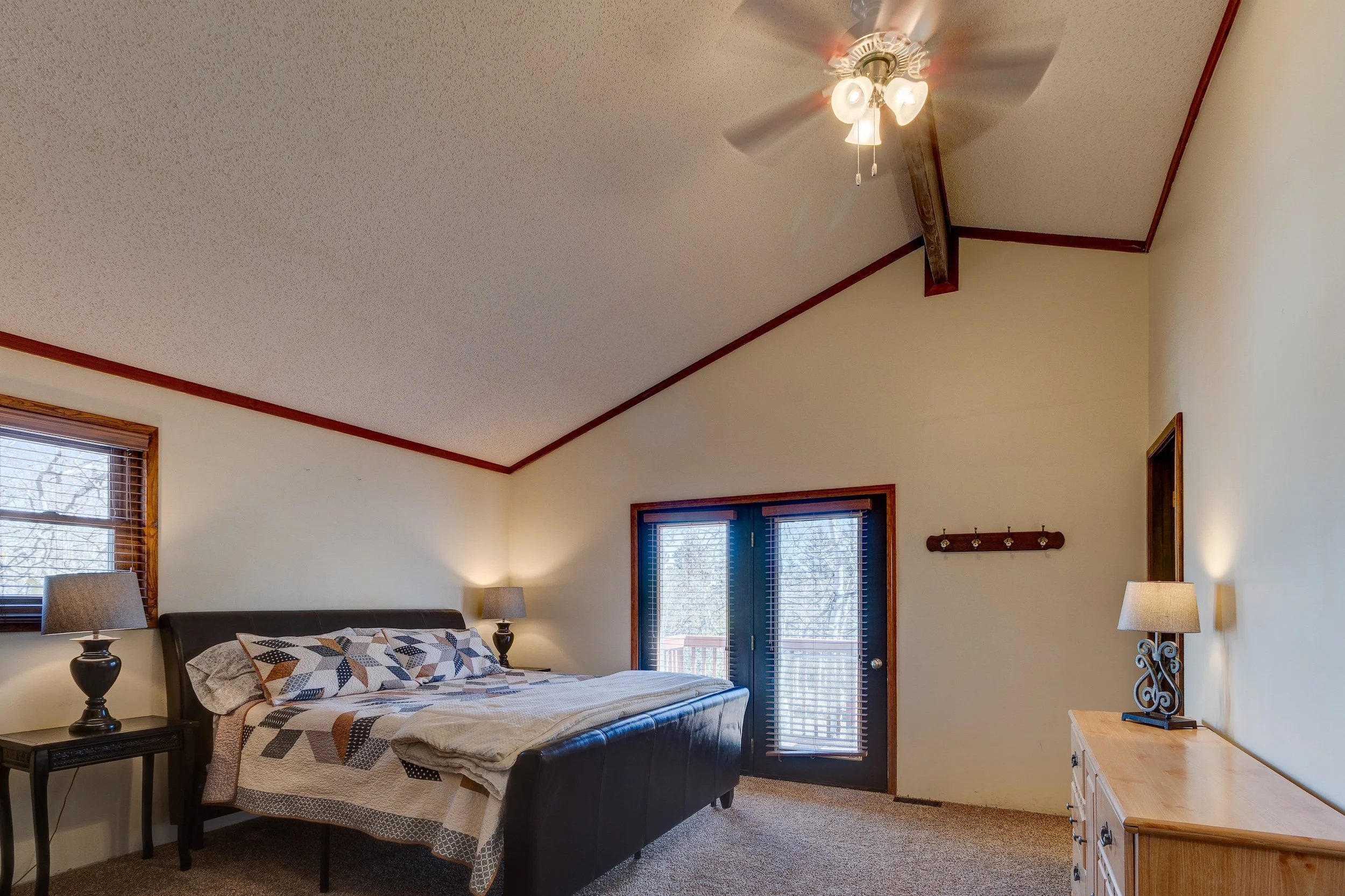 20-Primary BD w private deck + adjoining bath.jpg