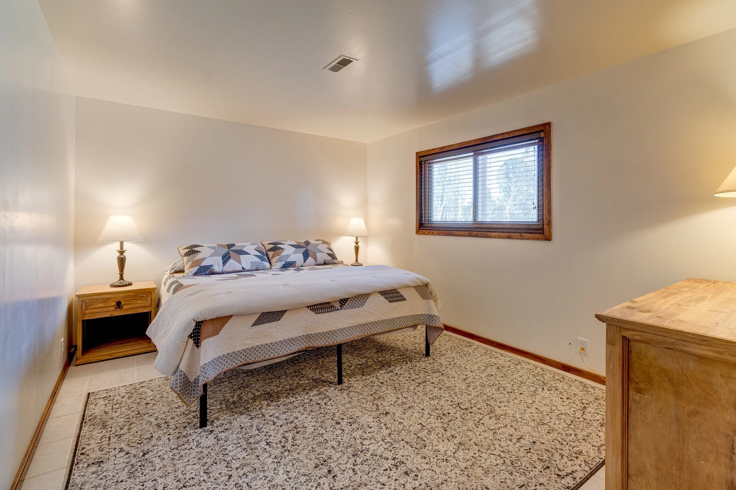 29-Lower level bedroom w tiled floors.jpg