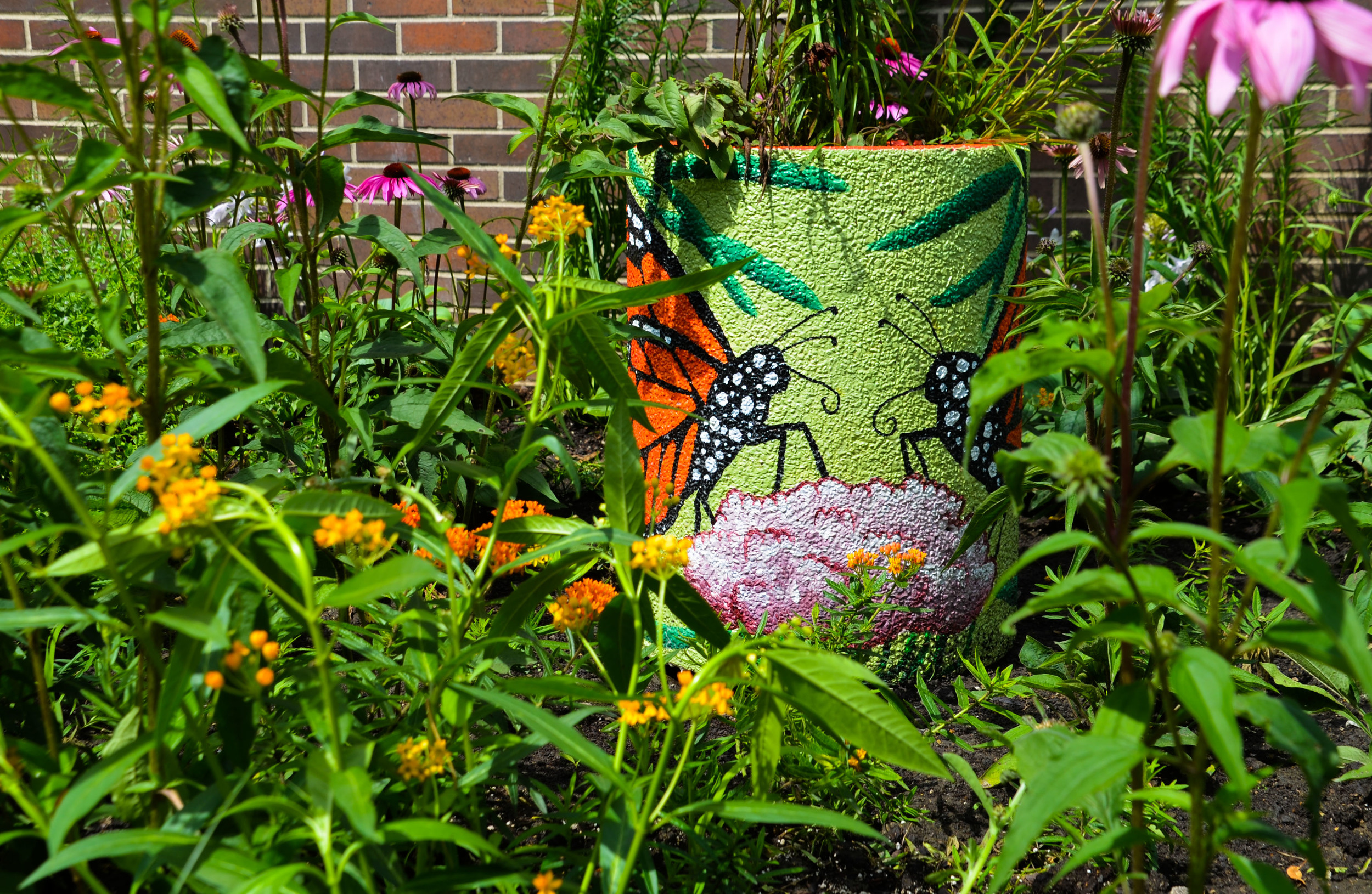 Pollinator urn picture with Monarch butterfly