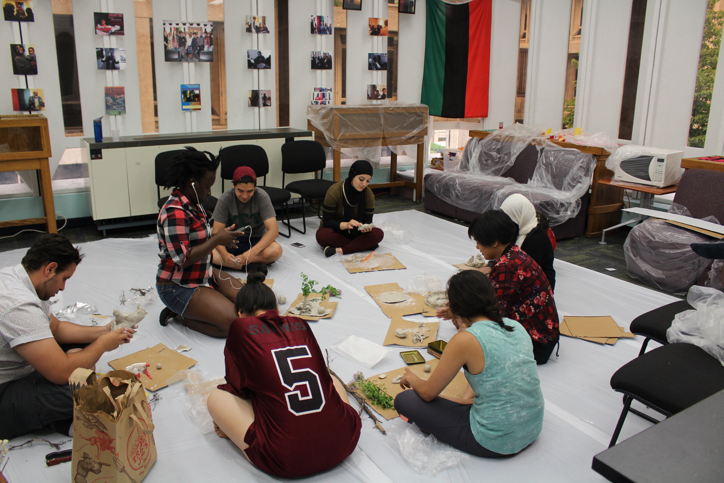 Picture of a different angle of Heritage Gardeners working on clay sculpture