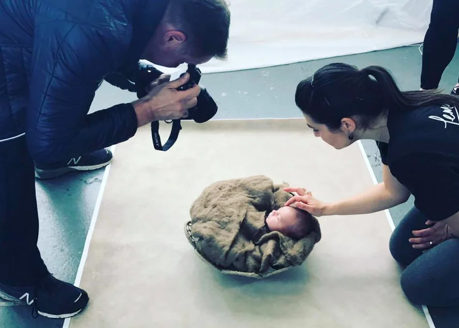 Making sure baby was safe and adorable for the student photographers. Photo Credit: Ana Brandt