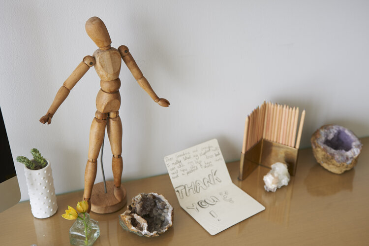 Table with small objects and thank you card