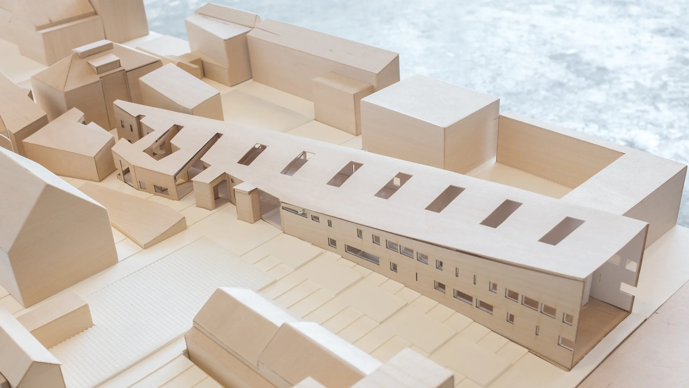 Pictured Model close-up Project A building that interrogates the idea of lateness Instructor Peter Eisenman with Elisa Iturbe Collaborators Ian Donaldson Description The avant-garde is linear. Adorno’s conception of Lateness, on the other hand, rejects ideological progress and Hegelian notions of time. This project attempted to construct a problematic relationship between the operational methodology of the deconstructivists, the root of the digital in architecture today, and at the other hand contemporary fluid parametricized systems. Our site, adjacent to the center of New Haven’s Nine-Square Grid and along the axis of Sterling Memorial Library and Cross-Campus, led to a prioritization of the imaginary or virtual conditions of the site to challenge the intense linear axis and physical presence of Sterling Memorial Library. The collision of the linear grid, from Sterling, and virtual radial grid from the center of the 9-squares attempt to challenge the fascination in contemporary discourse of presence, iconicity and the physical properties of architectural objects.