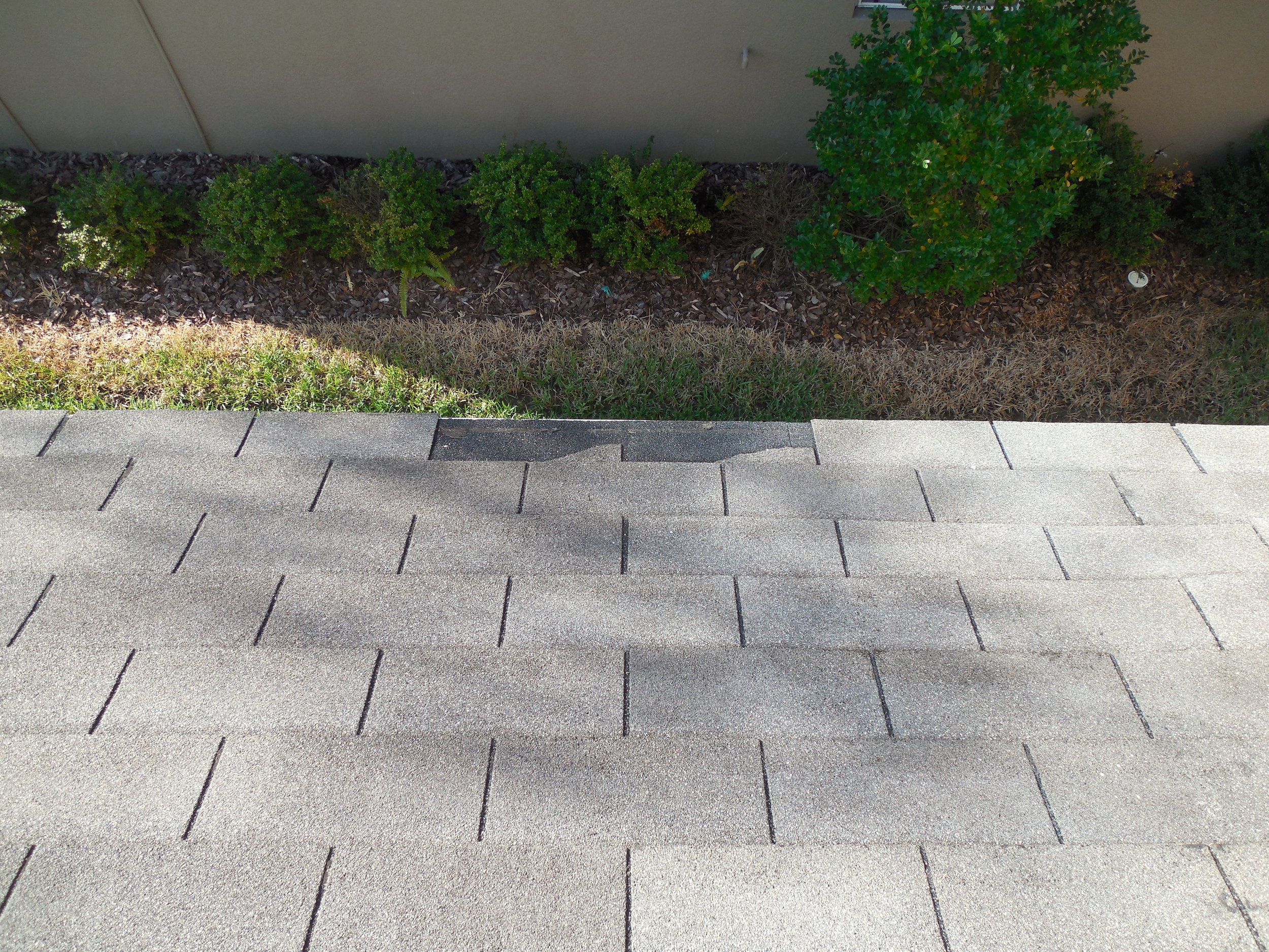 Missing shingles on a new construction home. Even new construction homes need inspections.