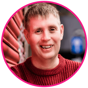 Headshot of Charles smiling at the camera