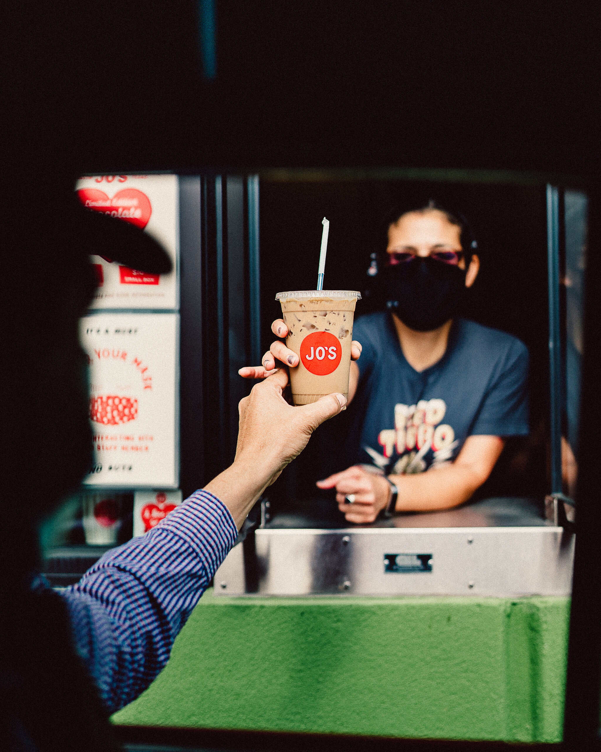  A guest receiving an iced coffee from a Jo’s drive thru. 