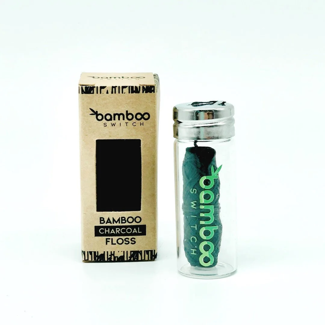 Organic vegan dental floss is infused with charcoal, and coated with candelilla wax.