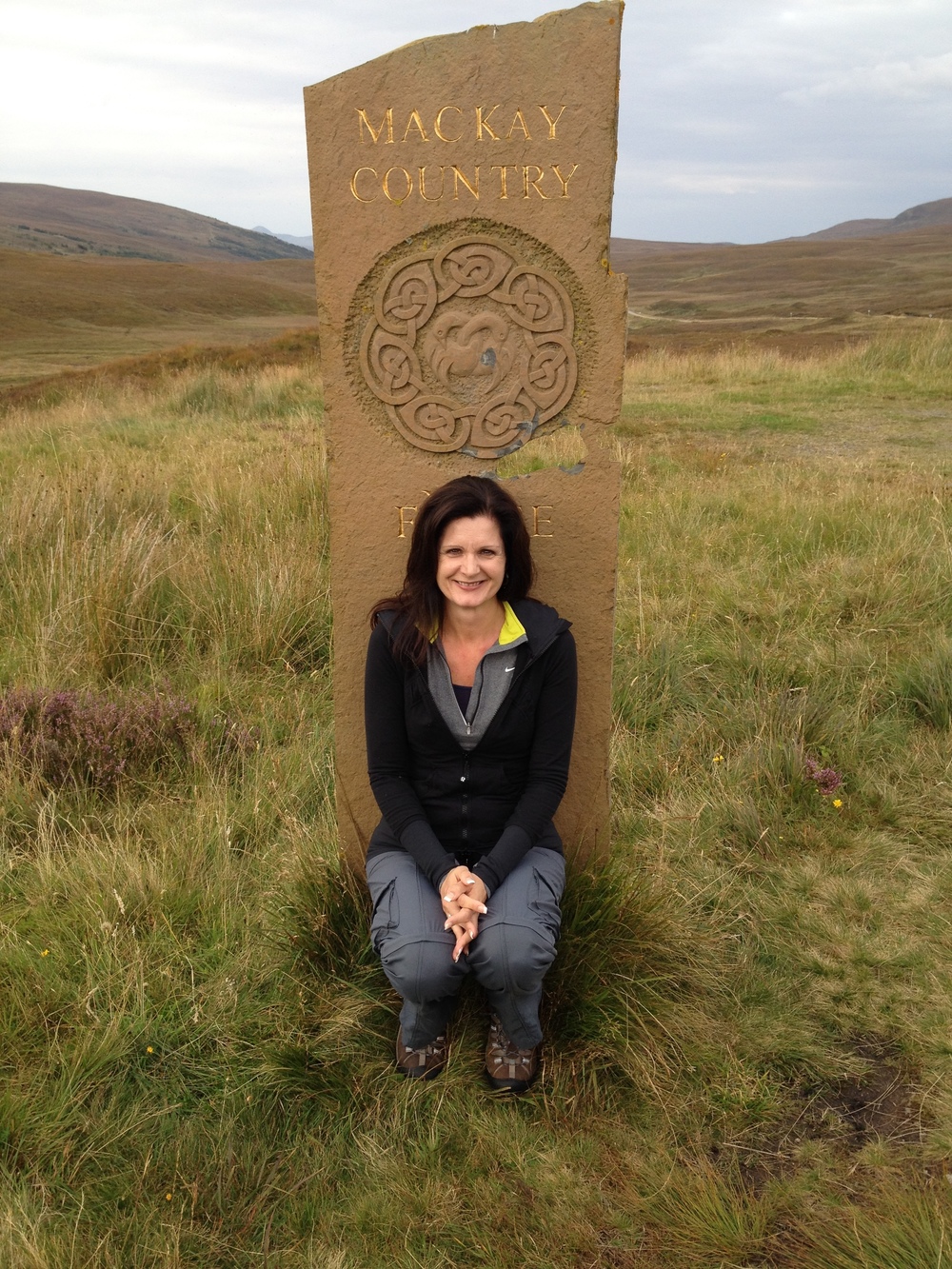 Theresa Mackay doing some ancestral tourism of her own in Scotland. Photo copyright and courtesy Theresa MacKay.